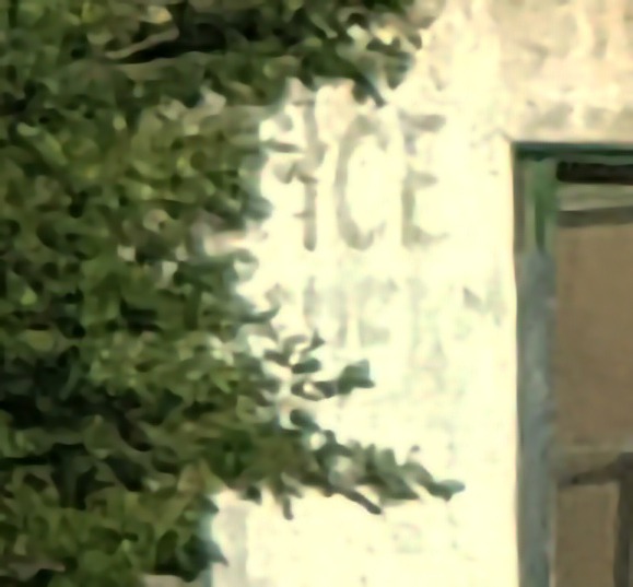 Close up of Ice Cream on the wall of an abandoned business